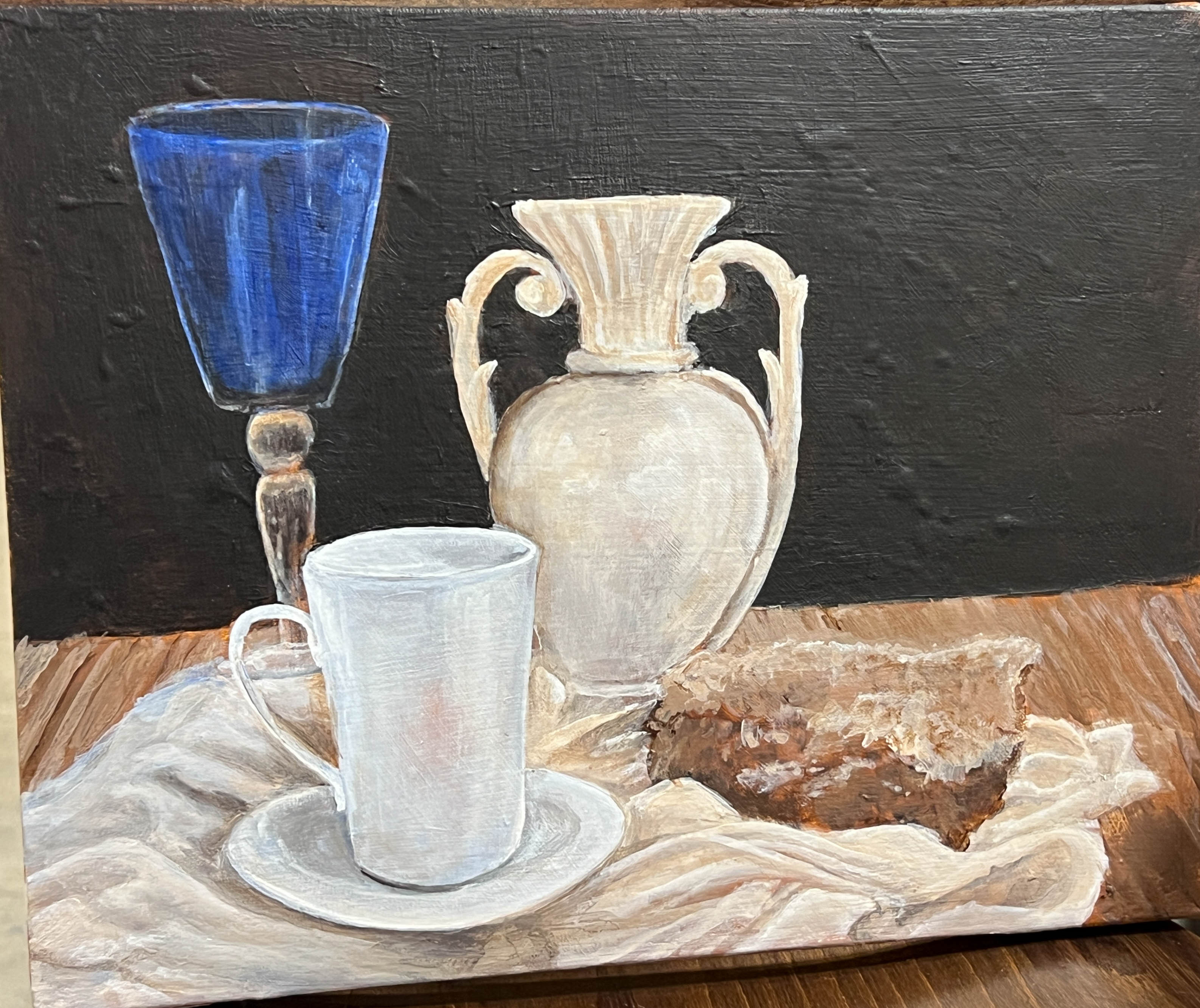 Acrylic on canvas still life of a blue wine glass beside a white coffee cup, a rough stone, and a simple ceramic vase on a neutral-toned tabletop.